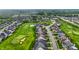 Community aerial featuring manicured lawns, golf course, and tree-lined streets, showcasing a desirable neighborhood at 20010 Prescott Pl, Westfield, IN 46074