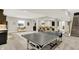 Large basement with ping pong table, bar area, and stairs to upper level at 20010 Prescott Pl, Westfield, IN 46074