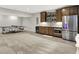 Finished basement with a wet bar, stainless steel refrigerator, tile backsplash, and space for recreation at 20010 Prescott Pl, Westfield, IN 46074