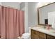 Bathroom featuring a tiled shower, vanity with framed mirror, and a patterned shower curtain at 20010 Prescott Pl, Westfield, IN 46074