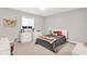 Bright bedroom with neutral tones, a comfortable bed, and ample natural light from the window at 20010 Prescott Pl, Westfield, IN 46074