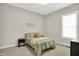 Comfortable bedroom with a bed, neutral decor, and a large window for natural light at 20010 Prescott Pl, Westfield, IN 46074