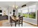 Cozy dining area with large windows offering a view of the outdoor space at 20010 Prescott Pl, Westfield, IN 46074