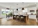 Bright open-concept kitchen features white cabinetry, a large island, and stainless steel appliances at 20010 Prescott Pl, Westfield, IN 46074