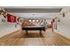 Expansive finished basement with a billiards table, seating and kitchenette provides space for entertainment and relaxation at 205 Canaan Ct, Mooresville, IN 46158