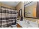 Bathroom with neutral walls, vanity with sink, mirror, and shower/tub combo at 205 Canaan Ct, Mooresville, IN 46158