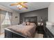 Bedroom with a black accent wall, decorative pillows, and side tables with lamps at 205 Canaan Ct, Mooresville, IN 46158