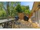 Outdoor deck features a dining table and seating, a grill, and privacy screens at 205 Canaan Ct, Mooresville, IN 46158