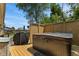 Outdoor deck offers a hot tub and grill, perfect for relaxation and entertaining at 205 Canaan Ct, Mooresville, IN 46158
