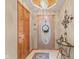 Inviting entryway with a decorative front door, tiled floor, and stylish lighting at 205 Canaan Ct, Mooresville, IN 46158