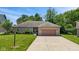Charming ranch home featuring a well-maintained lawn, landscaping, and a two-car garage at 205 Canaan Ct, Mooresville, IN 46158