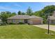 Charming ranch home with an attached two-car garage, landscaping, and a well maintained lawn at 205 Canaan Ct, Mooresville, IN 46158