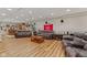 Finished basement boasts hardwood floors, leather sofas, and a bar area at 205 Canaan Ct, Mooresville, IN 46158