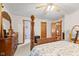 Spacious bedroom with a four-poster bed, neutral carpet, and inviting natural light at 205 Canaan Ct, Mooresville, IN 46158
