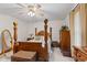 Relaxing bedroom with a four-poster bed, ample storage, and a bright ceiling fan at 205 Canaan Ct, Mooresville, IN 46158