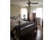 Comfortable bedroom with a wood-frame bed, matching dresser, and natural light filtering through sheer curtains at 21749 Oak Ridge Rd, Sheridan, IN 46069