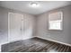 Bedroom featuring neutral walls, wood-look floors and a bright window at 2228 Dover St, Anderson, IN 46013