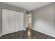 Bedroom featuring neutral walls, wood-look flooring, and a spacious closet at 2228 Dover St, Anderson, IN 46013