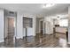 Kitchen with an open layout featuring white cabinets, laminate flooring, and modern appliances at 2228 Dover St, Anderson, IN 46013