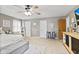 Spacious bedroom features a king bed, neutral decor, ceiling fan, and access to other rooms at 2249 Blossom Dr, Greenwood, IN 46143