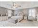Bright bedroom features a king bed, neutral decor, and ample natural light at 2249 Blossom Dr, Greenwood, IN 46143