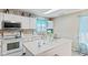 Bright kitchen featuring white cabinets, modern appliances, an island and natural light at 2249 Blossom Dr, Greenwood, IN 46143