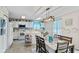 Bright dining area featuring white cabinets, modern appliances, and an open concept design at 2249 Blossom Dr, Greenwood, IN 46143