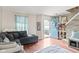 Inviting living room featuring hardwood floors, a comfortable sectional and natural light at 2249 Blossom Dr, Greenwood, IN 46143