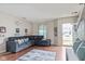 Inviting living room featuring hardwood floors, a comfortable sectional and natural light at 2249 Blossom Dr, Greenwood, IN 46143