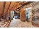 Unfinished attic space awaiting transformation with exposed rafters and insulation at 248 Runyon Ct, Greenwood, IN 46142