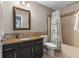 Bathroom featuring a vanity with granite countertop and tub with shower curtain at 248 Runyon Ct, Greenwood, IN 46142
