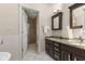 Bathroom with double sink vanity, granite countertop, and a step-in glass shower at 248 Runyon Ct, Greenwood, IN 46142