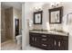 Well-lit bathroom featuring granite countertop vanity, tiled flooring, and glass enclosed shower at 248 Runyon Ct, Greenwood, IN 46142