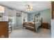 Bedroom featuring a four-poster bed, neutral carpet and two windows allowing ample natural light at 248 Runyon Ct, Greenwood, IN 46142