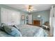 Comfortable bedroom featuring a four-poster bed, neutral carpet and two windows allowing ample natural light at 248 Runyon Ct, Greenwood, IN 46142