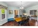 Eat-in kitchen space with wooden table and chair set with large window to backyard and cabinet space at 248 Runyon Ct, Greenwood, IN 46142
