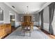 Formal dining room with wood furniture, chandelier lighting, and gray accent wall with decor at 248 Runyon Ct, Greenwood, IN 46142