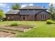 Exterior of home with a large manicured lawn and raised garden beds at 248 Runyon Ct, Greenwood, IN 46142