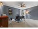 A home office with gray walls, a wooden desk, and natural light at 248 Runyon Ct, Greenwood, IN 46142