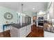 This eat-in kitchen has gray cabinets, granite countertops, stainless steel appliances, and an island with bar seating at 248 Runyon Ct, Greenwood, IN 46142