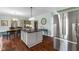 Spacious kitchen boasts gray cabinets, stainless appliances, and a central island with bar seating perfect for gatherings at 248 Runyon Ct, Greenwood, IN 46142