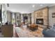 Cozy living room with stone fireplace and large windows offering natural light at 248 Runyon Ct, Greenwood, IN 46142