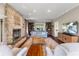 Inviting living room features a stone fireplace, bookshelves and hardwood floors at 248 Runyon Ct, Greenwood, IN 46142