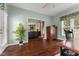 Inviting living room with hardwood floors and open archway to dining and living room area with lots of natural light at 248 Runyon Ct, Greenwood, IN 46142