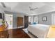 This expansive bedroom features hardwood floors, a tray ceiling, and an ensuite bathroom at 248 Runyon Ct, Greenwood, IN 46142