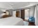 Light-filled bedroom boasts wood floors, tray ceiling, a barn door, and a ensuite bathroom at 248 Runyon Ct, Greenwood, IN 46142
