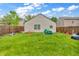 Wide open backyard with wood privacy fence and a grassy lawn, perfect for entertaining or relaxation at 2740 Braxton Dr, Indianapolis, IN 46229