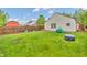 Spacious backyard surrounded by a wood privacy fence with a lush green lawn, perfect for outdoor activities at 2740 Braxton Dr, Indianapolis, IN 46229