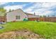 Large, grassy backyard with a wood fence offering privacy, great for pets, play, and gardening at 2740 Braxton Dr, Indianapolis, IN 46229