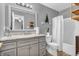 Well-lit bathroom features a modern vanity with a marble countertop and a shower-tub combo at 2740 Braxton Dr, Indianapolis, IN 46229